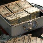 hard-cash-on-a-briefcase